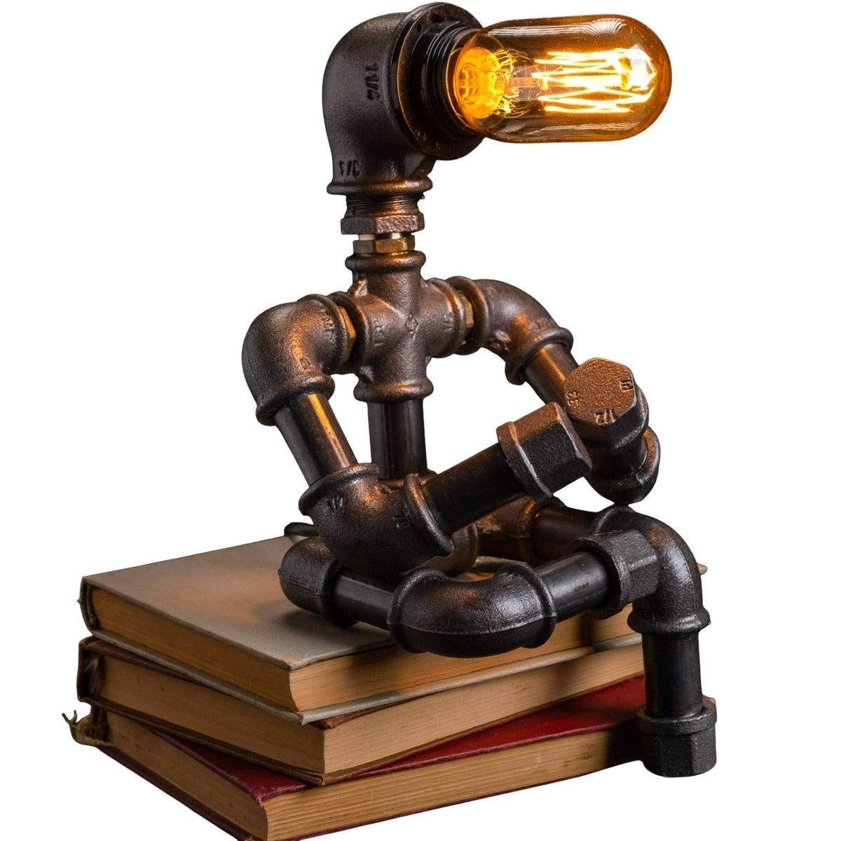 IronPunky Kapitelträumer Tischlampe aus rustikalen Temperguss-Rohren in Form einer lesenden Figur mit Amber-Glühbirne